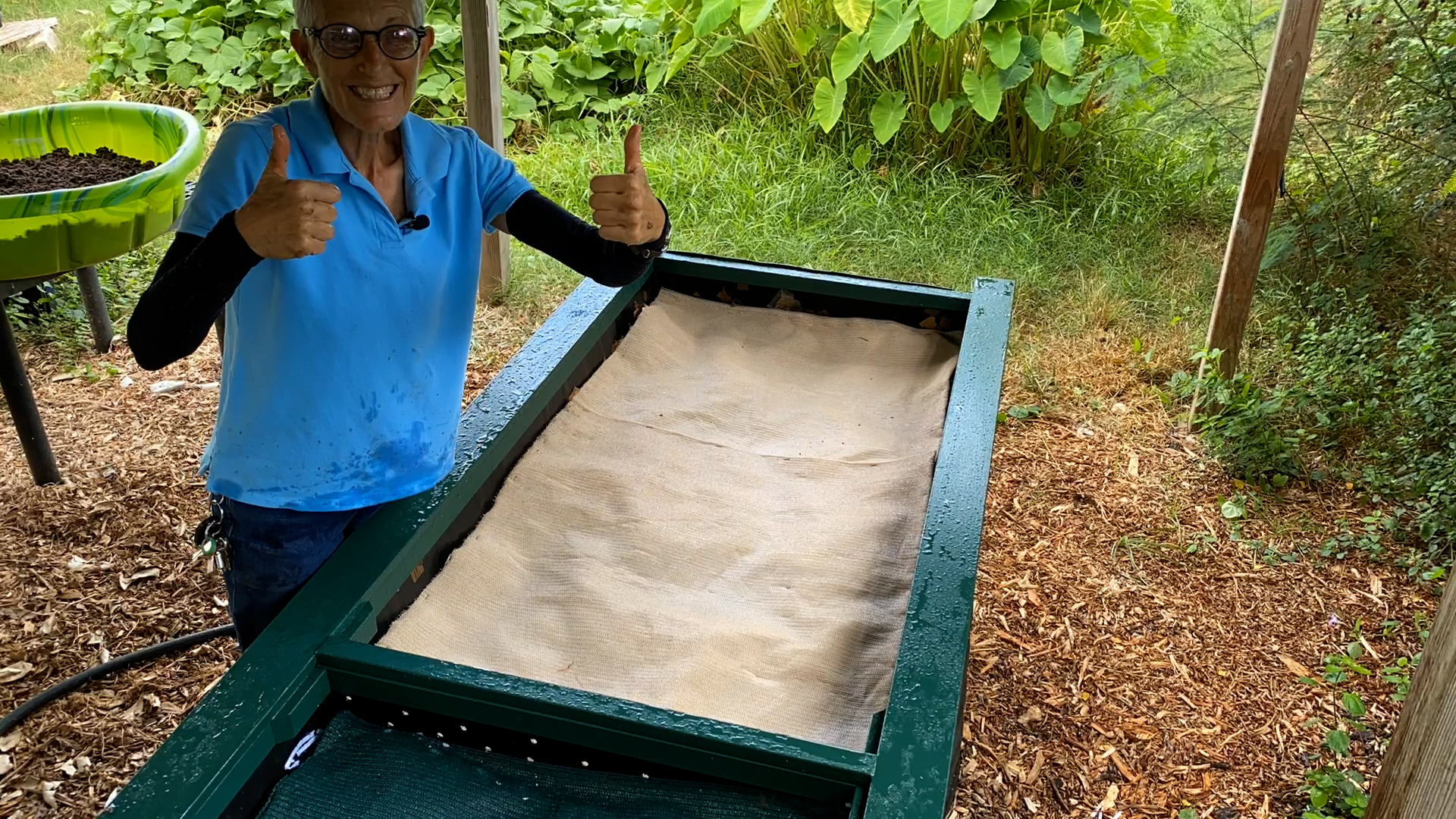 Mindy giving a thumbs up after re-bedding a worm bin